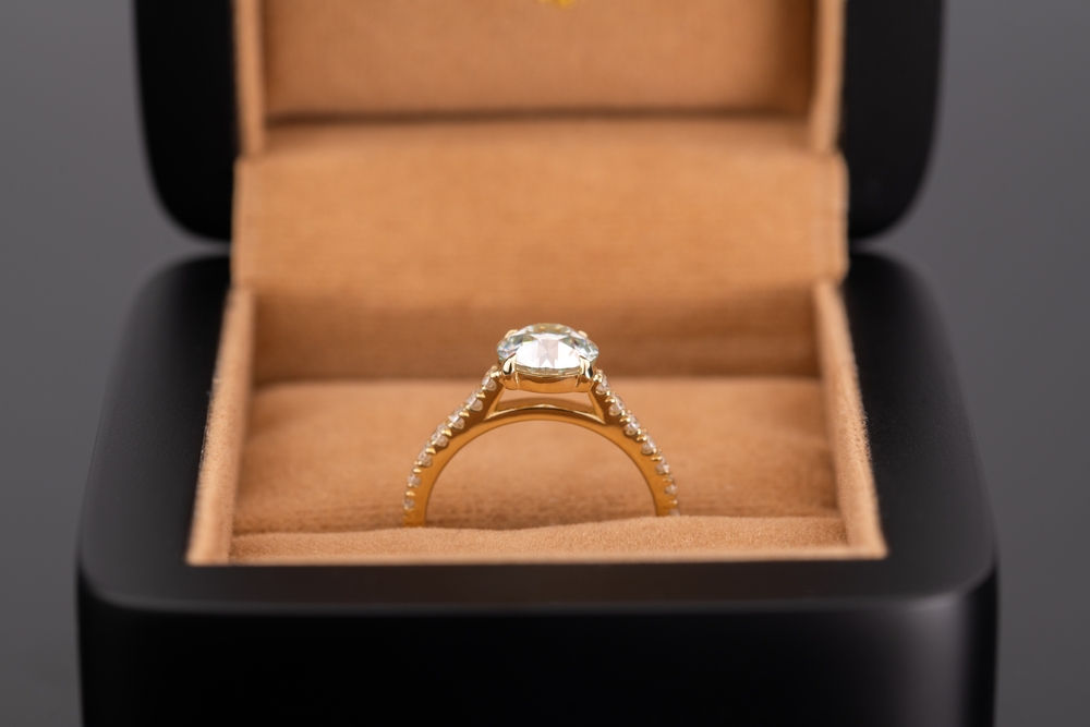 diamond ring on gold cathedral setting ring