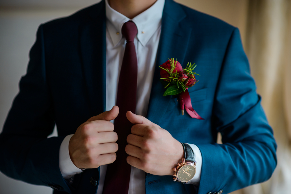 groom wearing navy blue suit