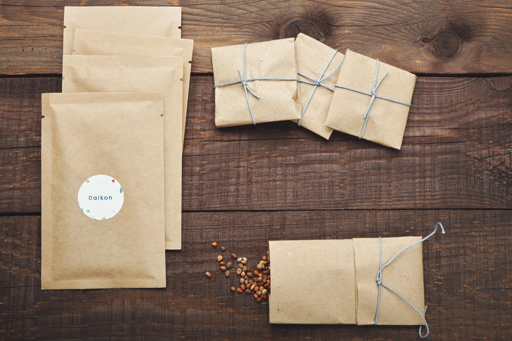 seed packets on top of wooden table