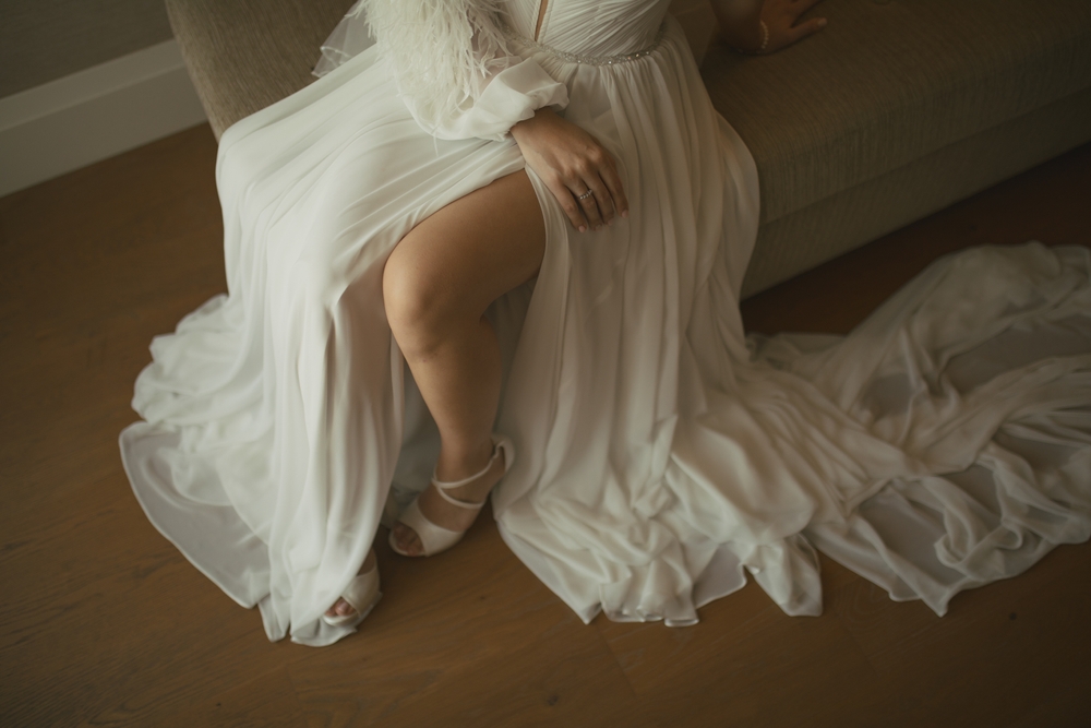 sitting bride on slit wedding dress