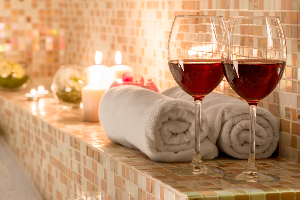 two wine glasses in bathroom for spa night