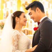 Bride and groom looking lovingly at each other inside a brightly lit church sanctuary
