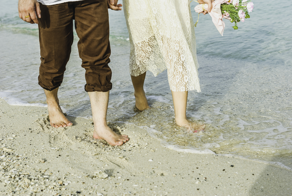 bride and groom on beach