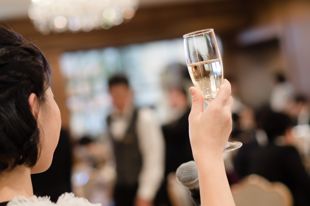 maid of honor raising a toast after speech