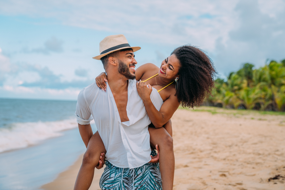 smiling couple on their beach honeymoon