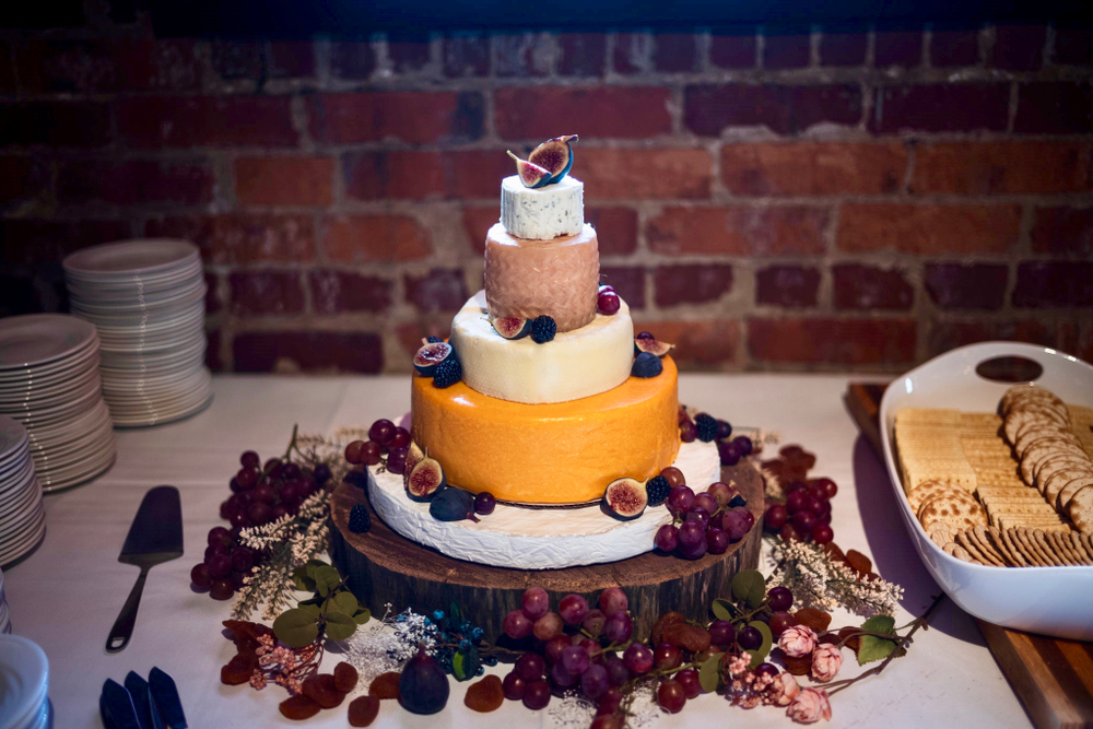 stack of cheese wheels at a wedding