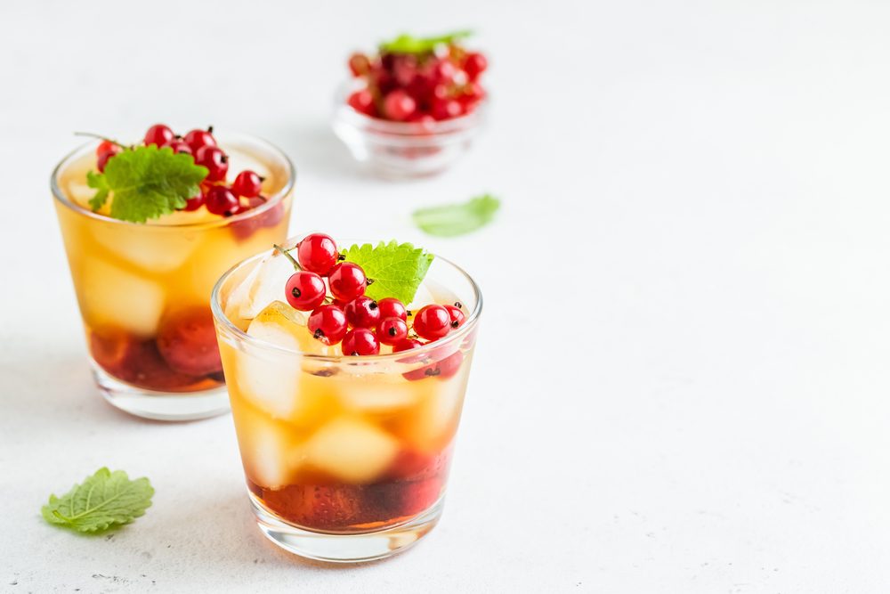 two glasses of strawberry hibiscus mocktails