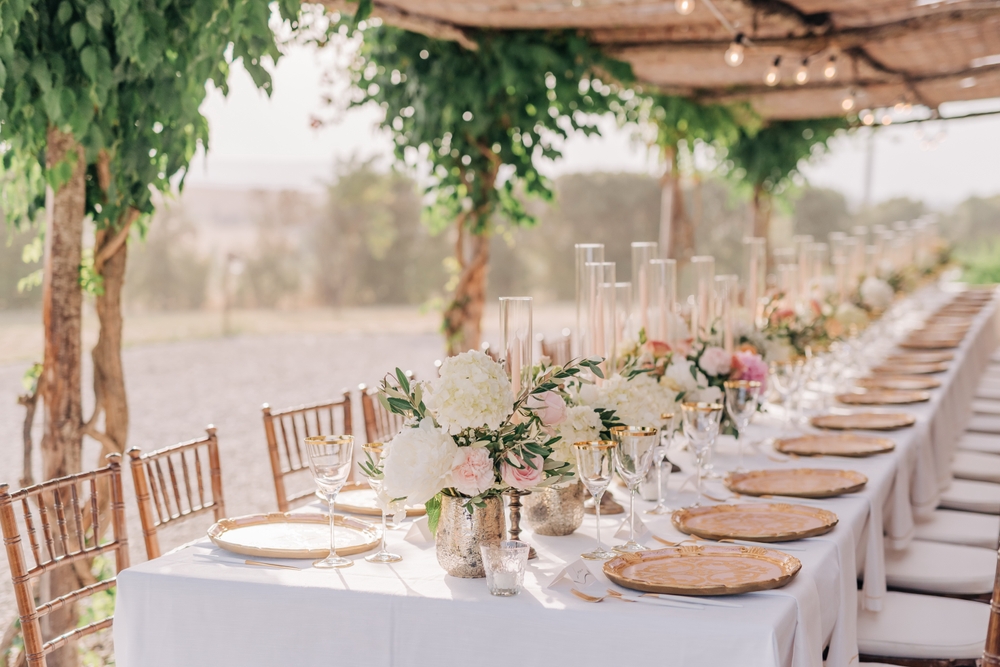 wedding table decorated with peonies on vases