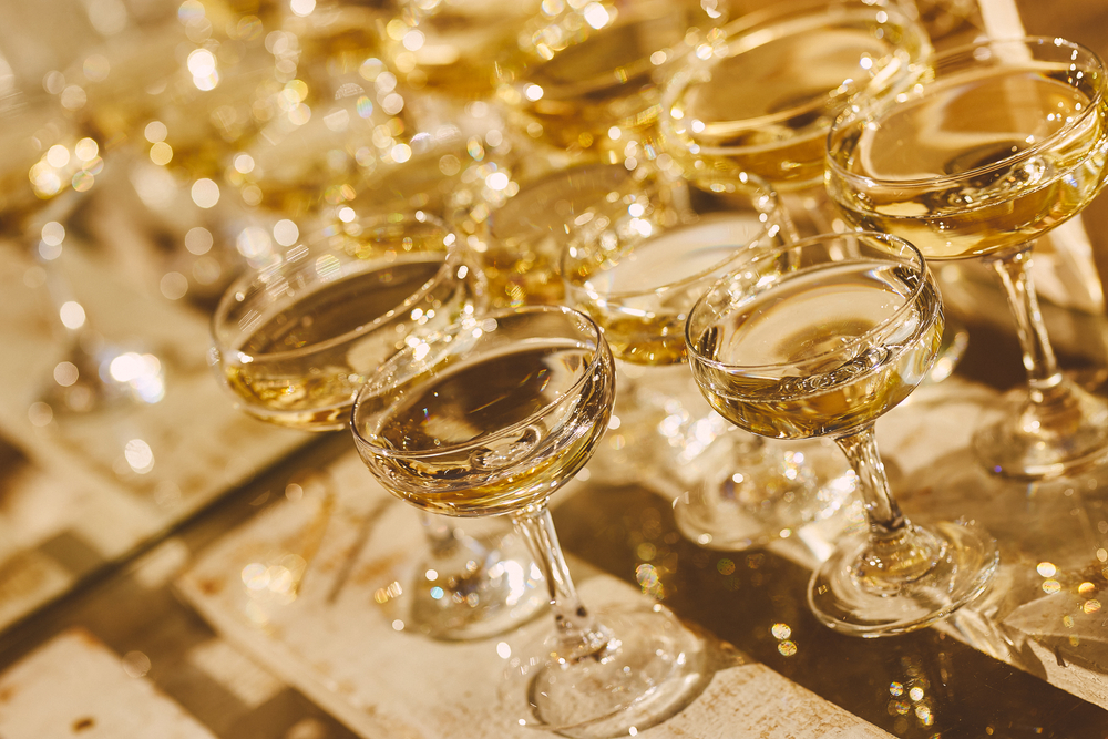 Martini glasses stand on a wooden stand