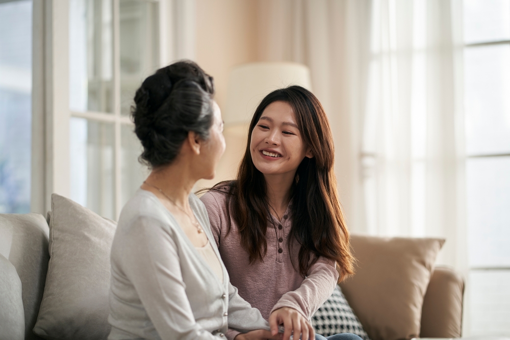 asian mother and daughter talking