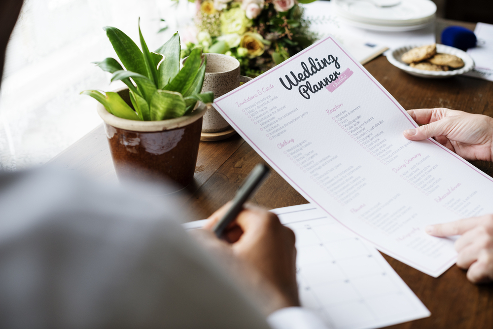 hands holding wedding planner 