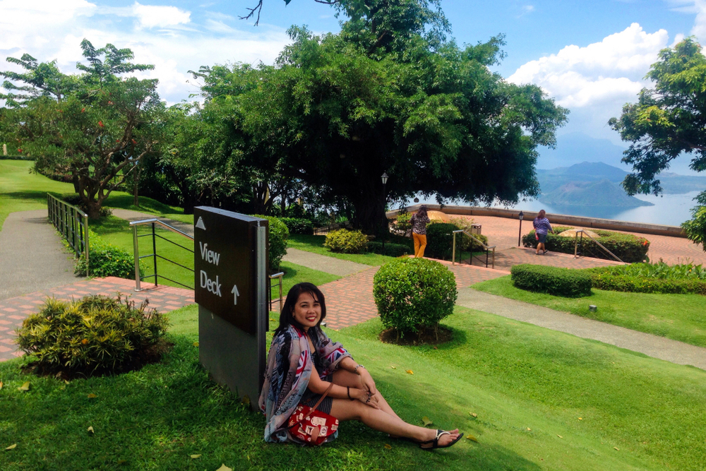 woman sitting on grass in Taal Vista in Tagaytay City