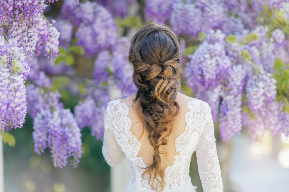 back of bride with long fishtail hairstyle