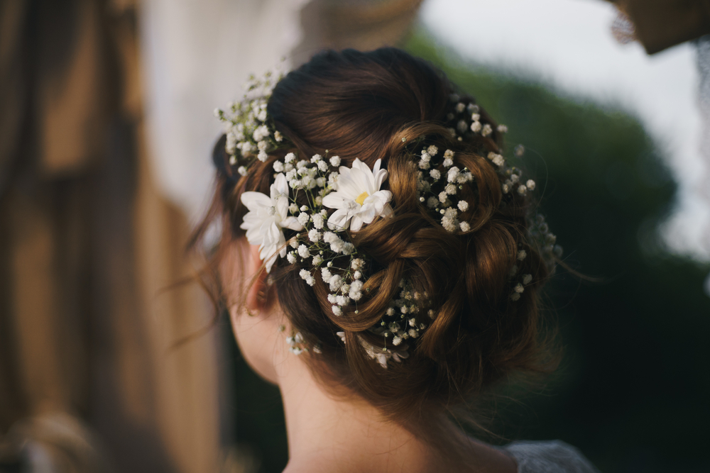 back view of bride's hairstyle with flowers