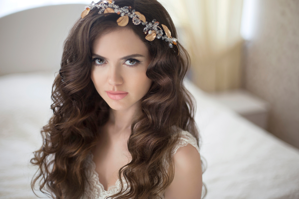 bride with long wavy hairstyle looking up