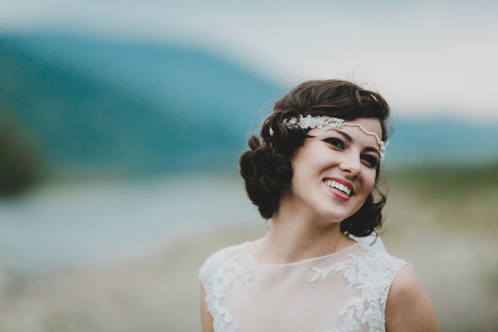 smiling bride with bobbed curly hairstyle