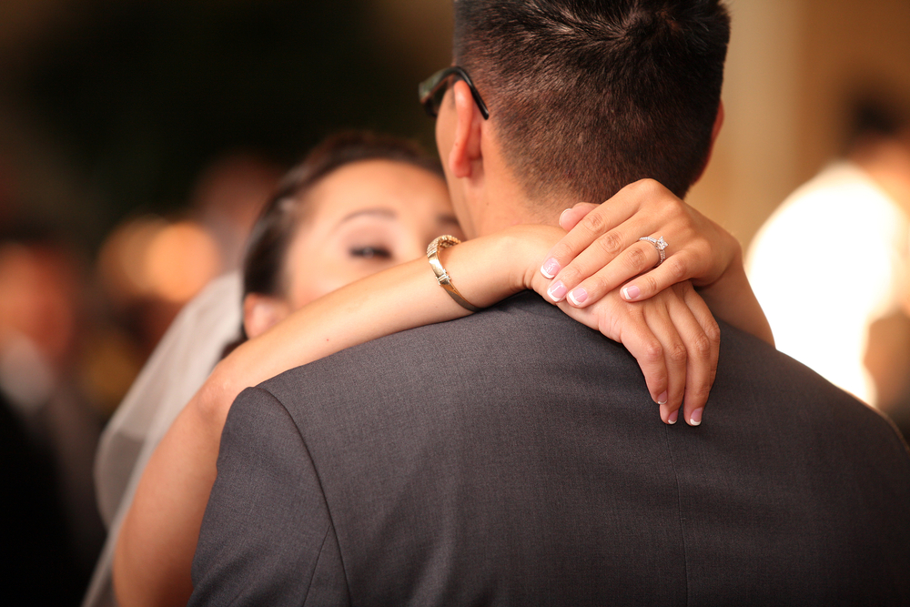 bride and groom slow dancing on their wedding