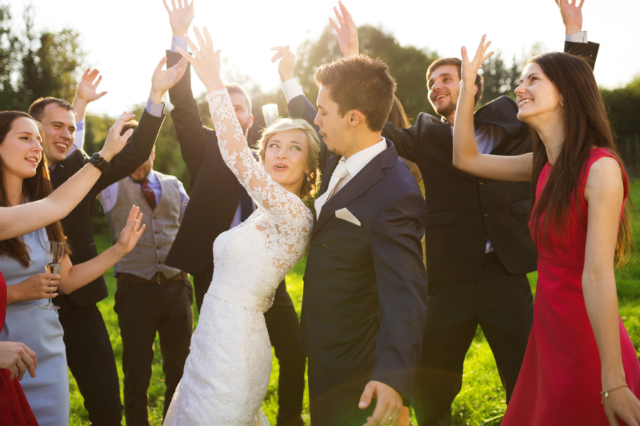 newly weds dancing with guests