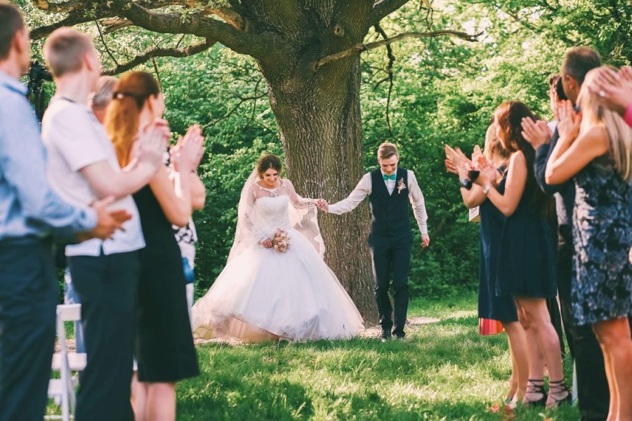wedding guests looking at the birde and groom