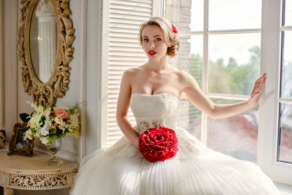 bride with red lipstick on her wedding day