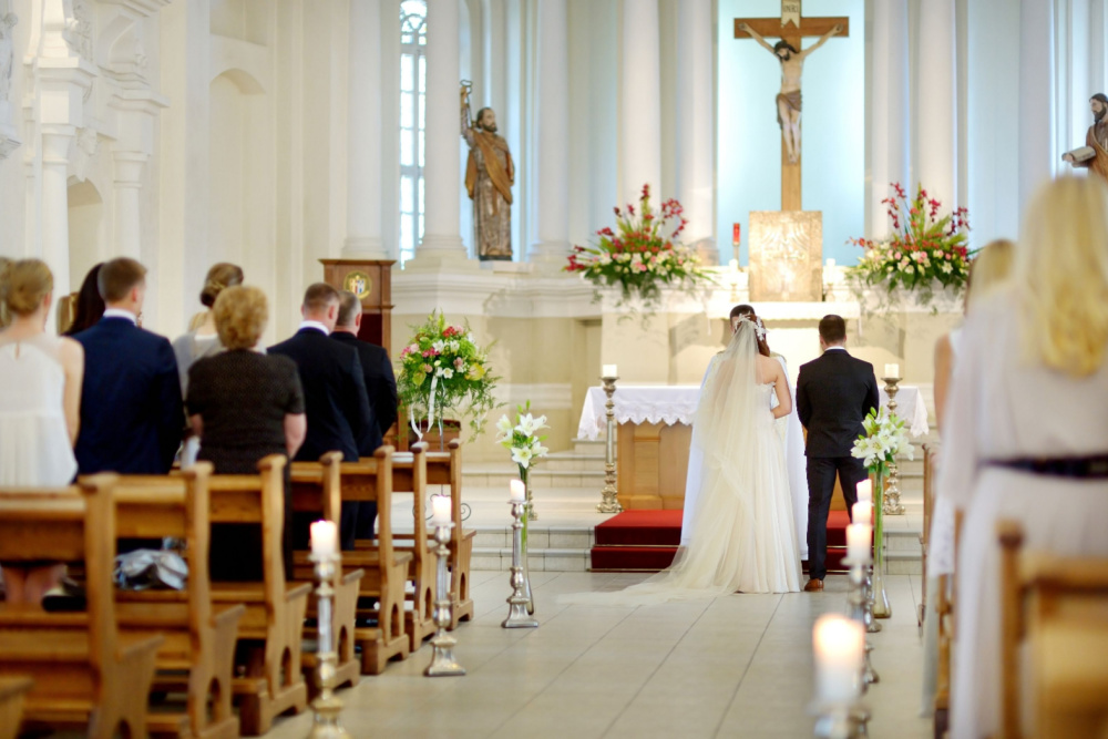 bride and groom having a church wedding