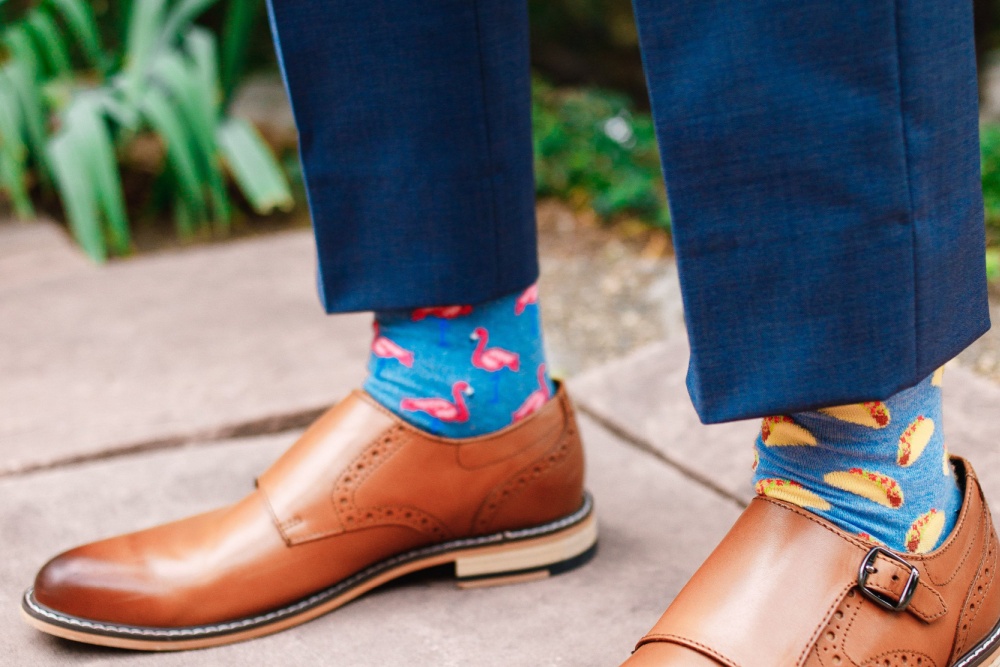 groom wearing socks with an animal print and food