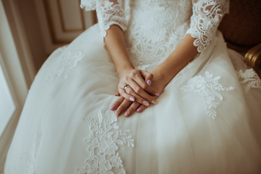 bride with her hands crossed on her lap