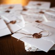 pile of wedding invitations with oil seal