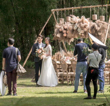 bride and groom standing on their outdoor wedding