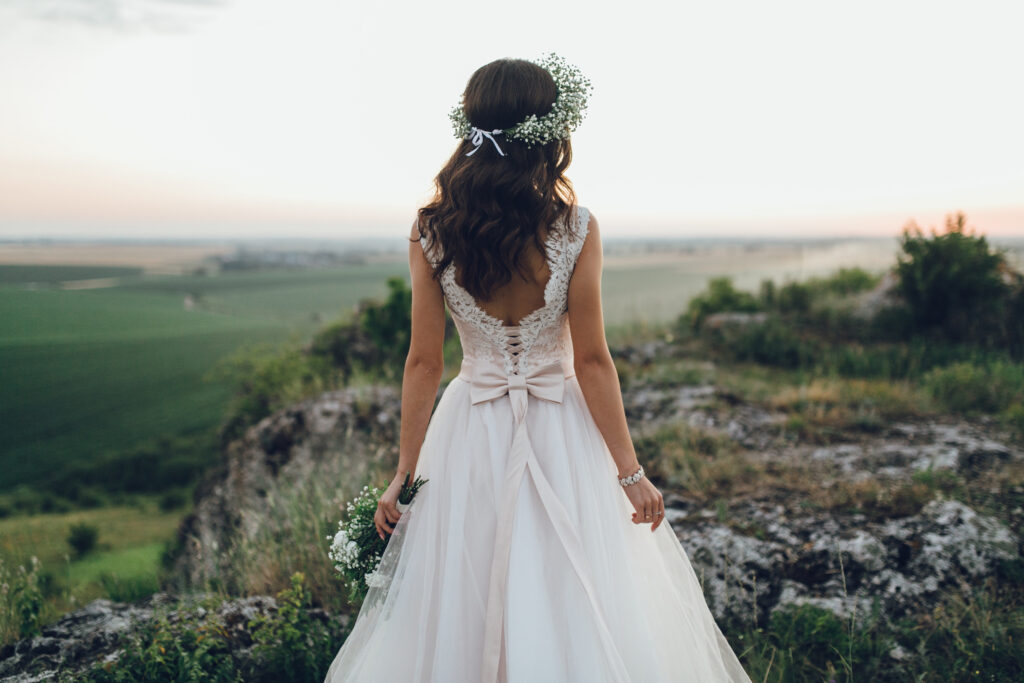the bride posing on a hill