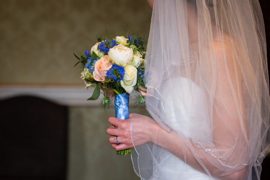 a bride with a shouldered length veil