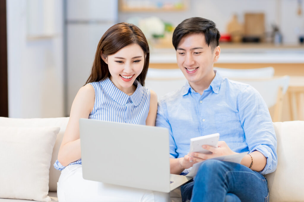 a couple using a laptop