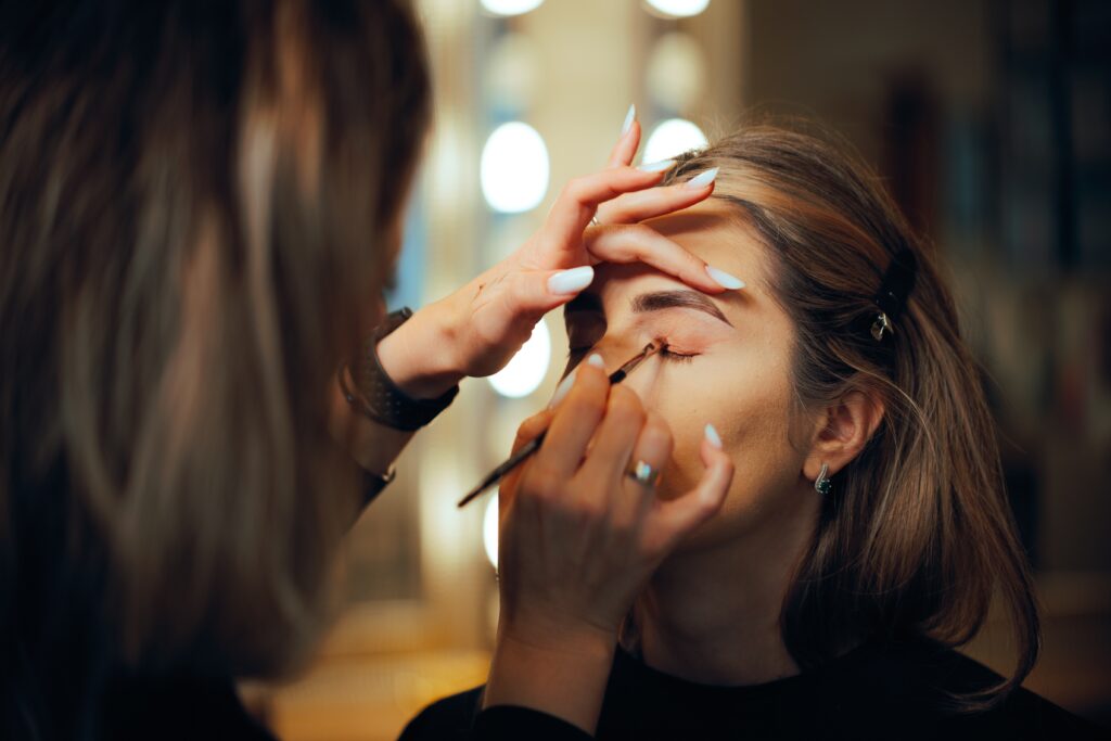 makeup being done to the bride