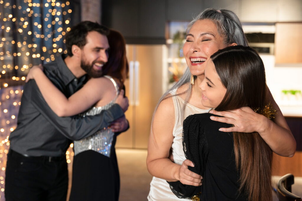 wedding guests hugging